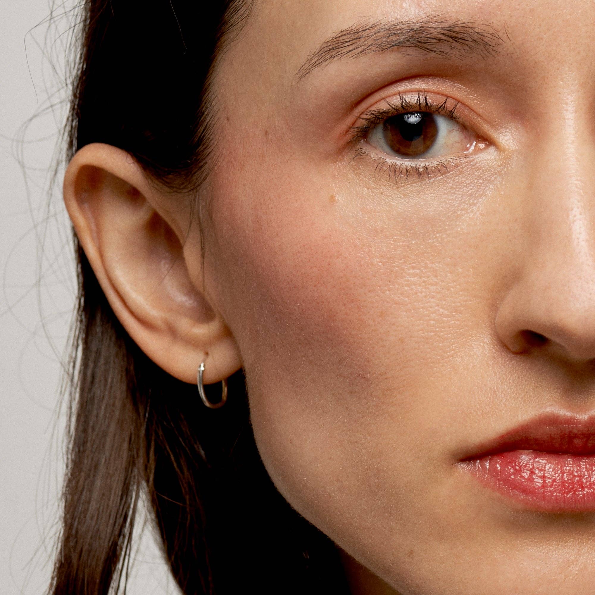 Close-up of a woman's face with a neutral background